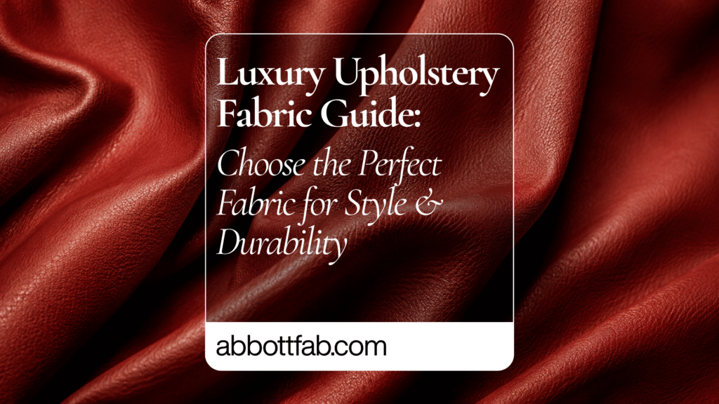 Promotional graphic featuring rich red luxury upholstery fabric with soft folds and a leather-like texture. Centered on the image is a translucent rounded rectangle containing elegant white typography that reads: ‘Luxury Upholstery Fabric Guide: Choose the Perfect Fabric for Style & Durability.’ At the bottom, the website name ‘abbottfab.com’ appears in bold black text on a white strip.