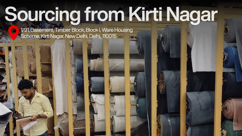 Sourcing fabrics from Kirti Nagar warehouse in New Delhi, featuring organized rolls of textile materials and a staff member inspecting fabric.