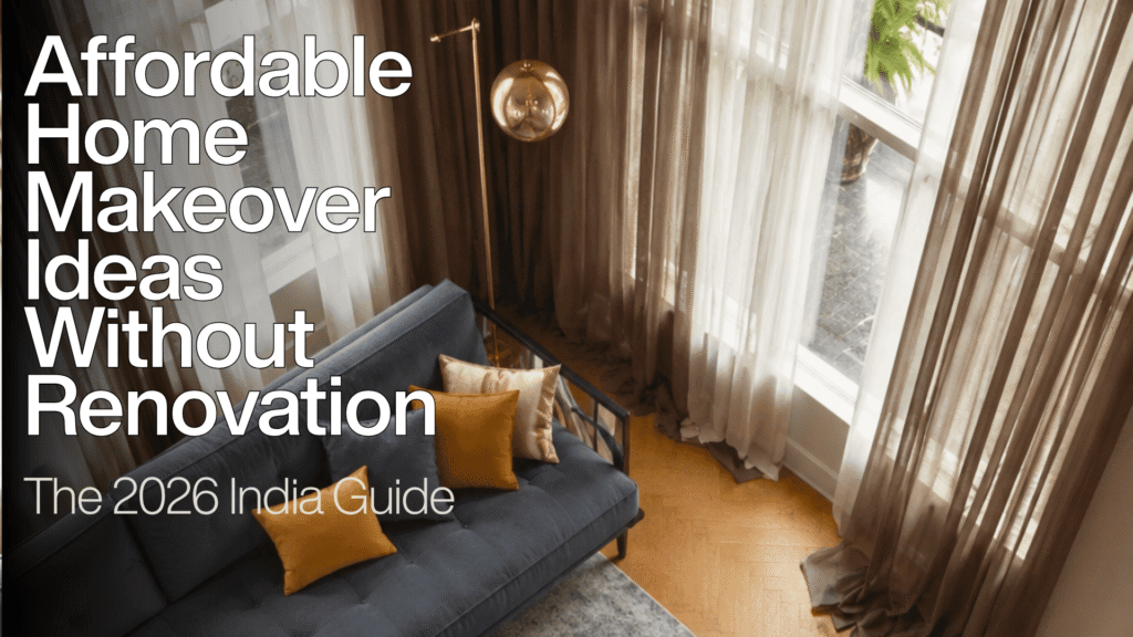 Header image titled Affordable Home Makeover Ideas Without Renovation: The 2026 India Guide, showing an overhead view of a styled living room featuring a dark blue tufted sofa with gold accent pillows and floor-to-ceiling sheer curtains