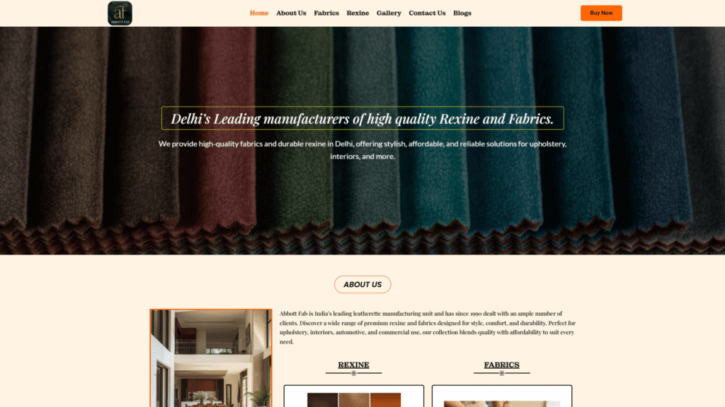 Abbott Fab website hero section featuring a header with navigation links, the headline Delhi's Leading manufacturers of high quality Rexine and Fabrics, a subtext about providing durable solutions for upholstery and interiors, and a background display of vertically draped fabric samples.
